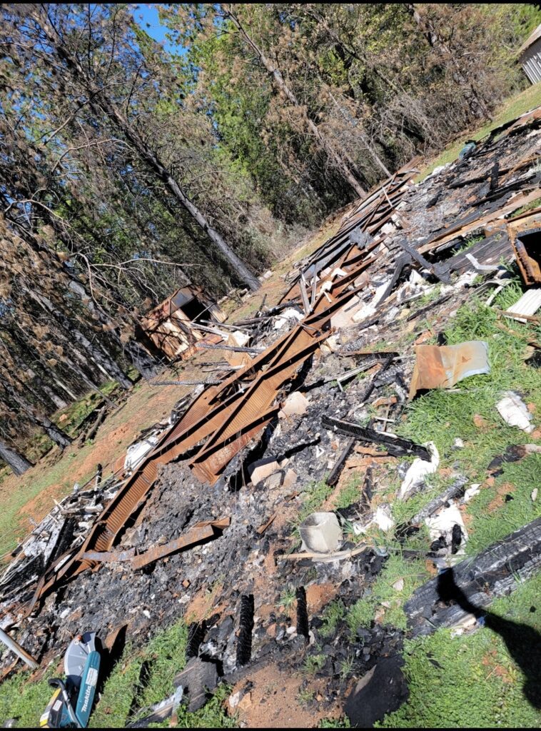 Demolition of burned down home before photo